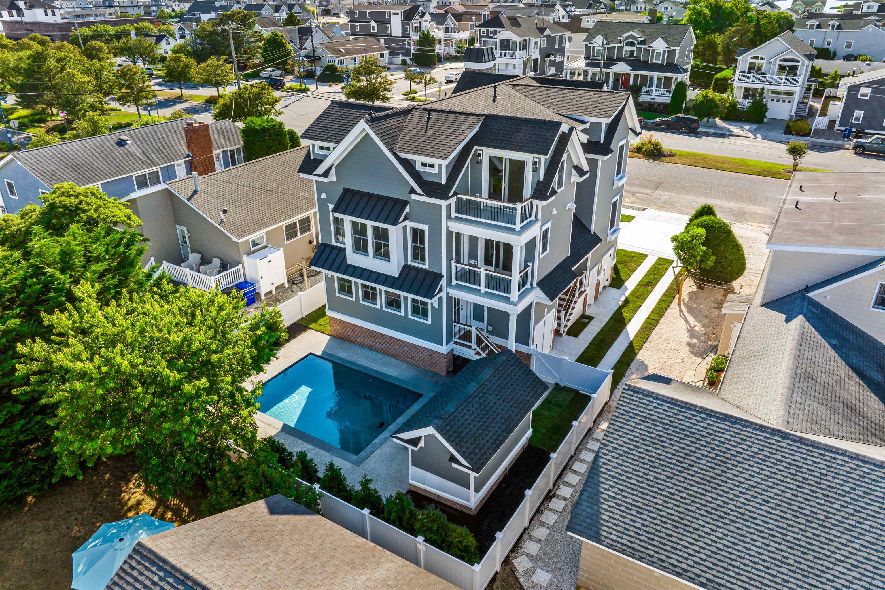 1819 Dune Drive Avalon, NJ 08202 - Photo 3 of 49 an aerial view of a house with swimming pool and outdoor seating