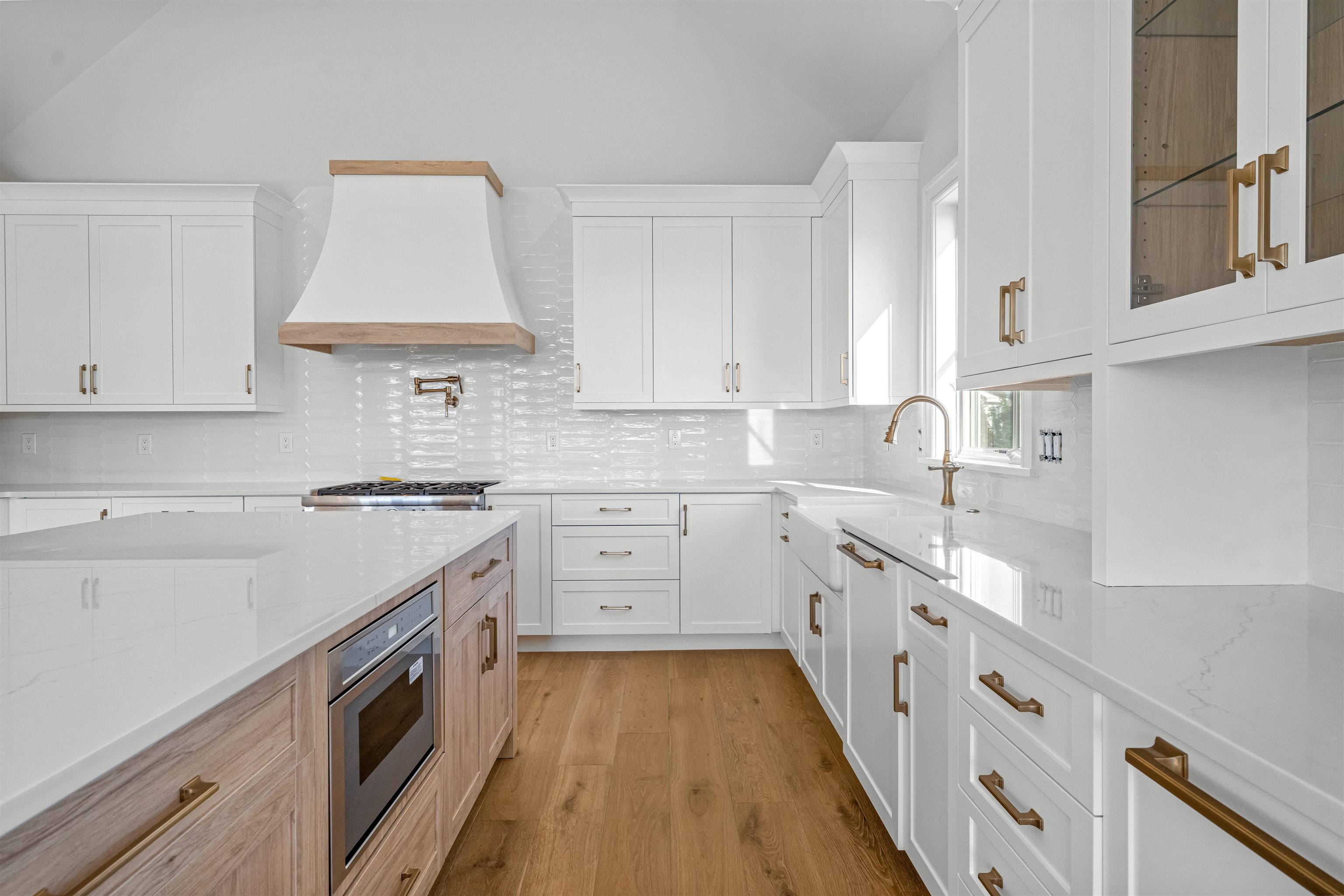 1819 Dune Drive Avalon, NJ 08202 - Photo 31 of 49 a kitchen with granite countertop a sink stove and cabinets