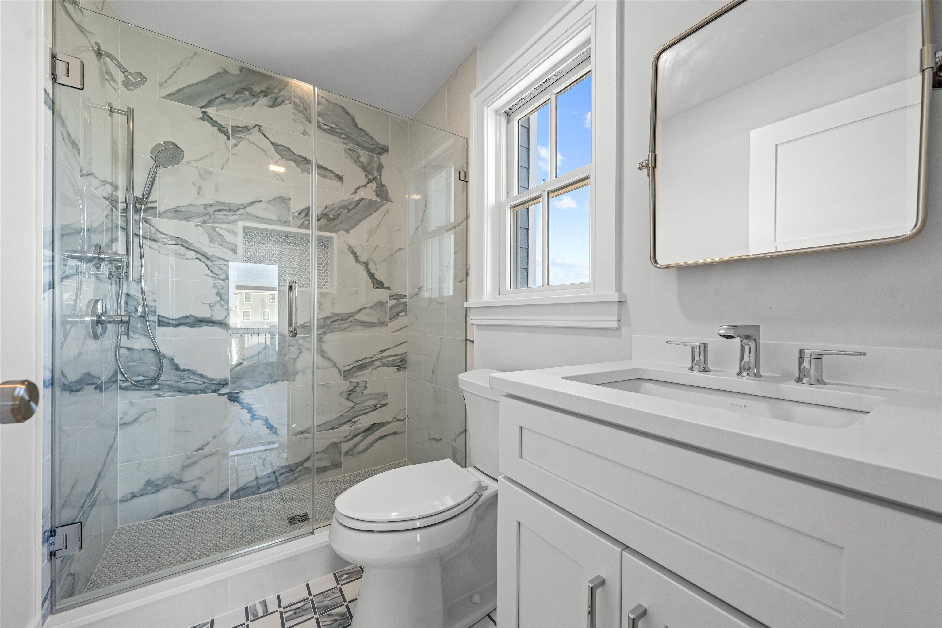 1819 Dune Drive Avalon, NJ 08202 - Photo 37 of 49 a bathroom with a granite countertop sink a toilet and a shower