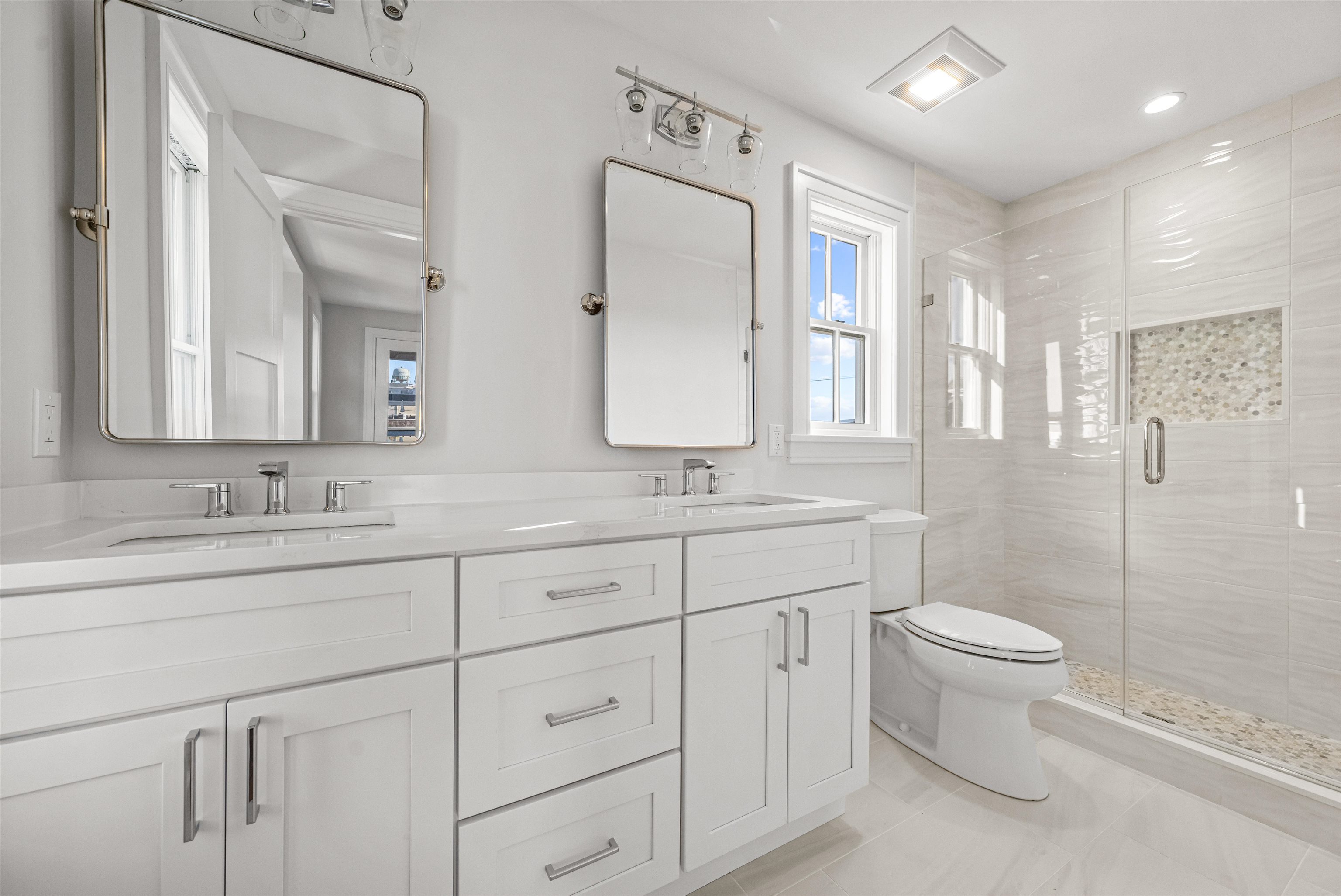 1819 Dune Drive Avalon, NJ 08202 - Photo 40 of 49 a bathroom with 2 sink toilet and a mirror