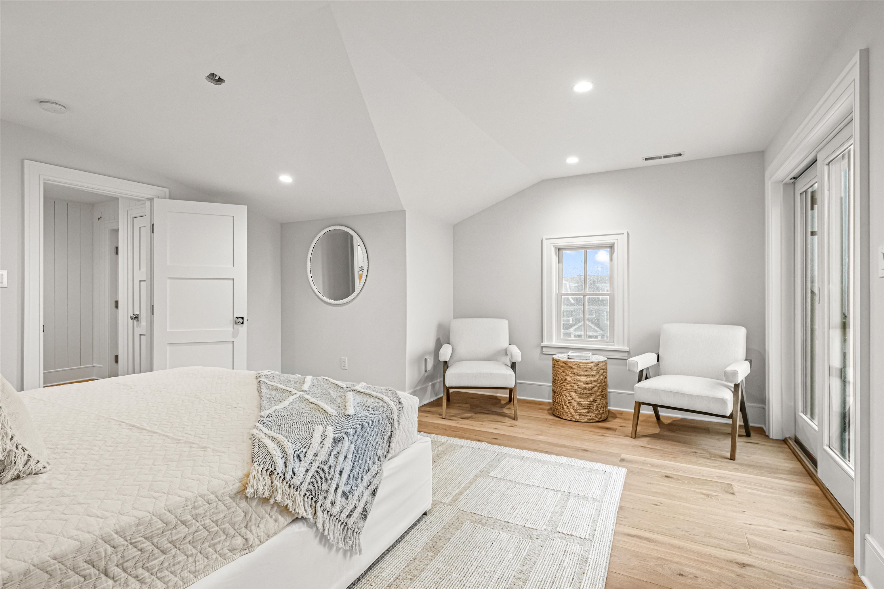 1819 Dune Drive Avalon, NJ 08202 - Photo 44 of 49 a spacious bedroom with a bed a couch and a window