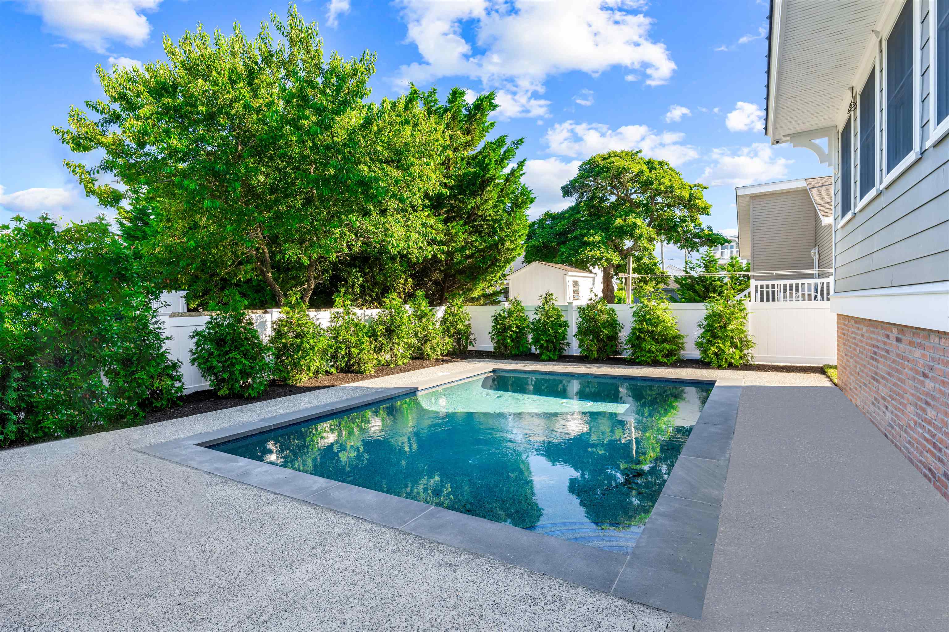 1819 Dune Drive Avalon, NJ 08202 - Photo 6 of 49 a view of a swimming pool with a yard