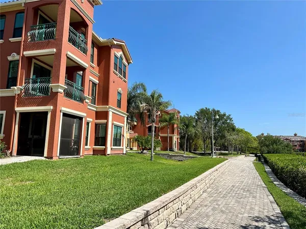 a view of a building with a yard