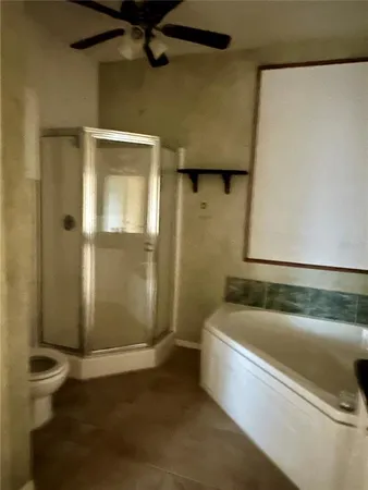 a bathroom with a tub and shower