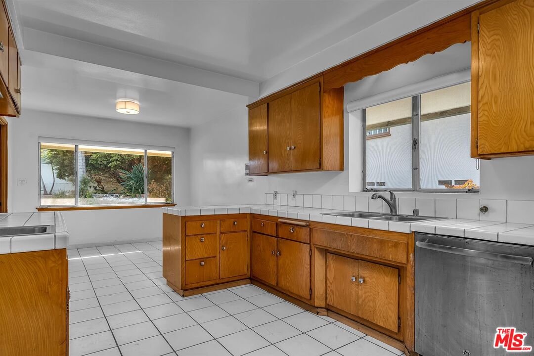 4320 Monteith Drive View Park, CA 90043 - Photo 6 of 17 a kitchen with a sink and cabinets