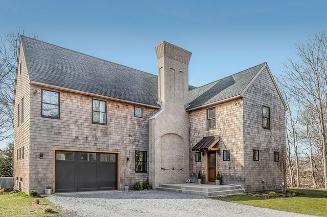 a front view of a house with yard