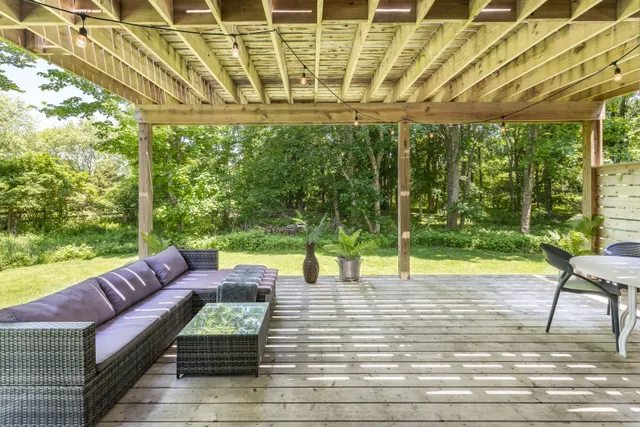 a view of a patio with couches and pool