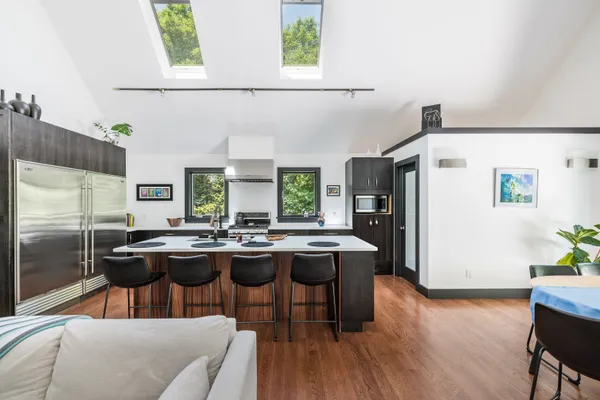 a kitchen with a table and chairs in it