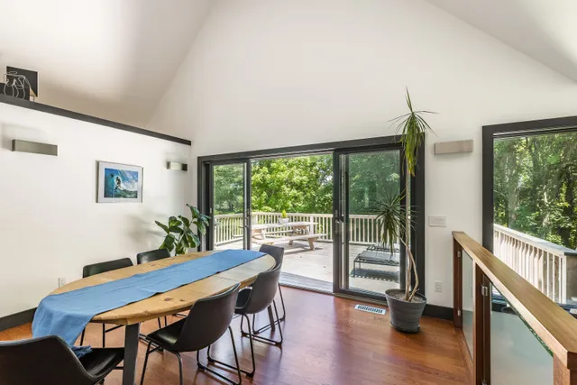 a view of a dining room with furniture window and wooden floor