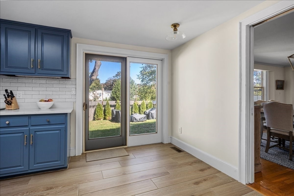 12 Merrymount Road Hingham, MA 02043 - Photo 11 of 18 a view of a utility room with wooden floor and cabinet