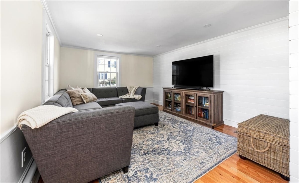 12 Merrymount Road Hingham, MA 02043 - Photo 12 of 18 a living room with furniture and a flat screen tv