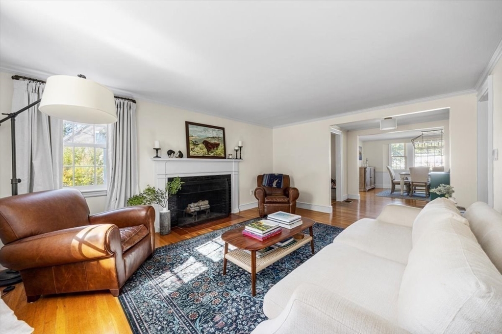 12 Merrymount Road Hingham, MA 02043 - Photo 2 of 18 a living room with furniture a rug and a fireplace