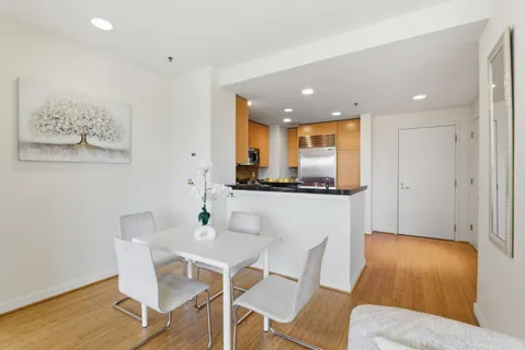 a kitchen with a table and chairs