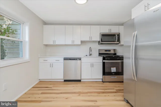 a view of kitchen with microwave and stove