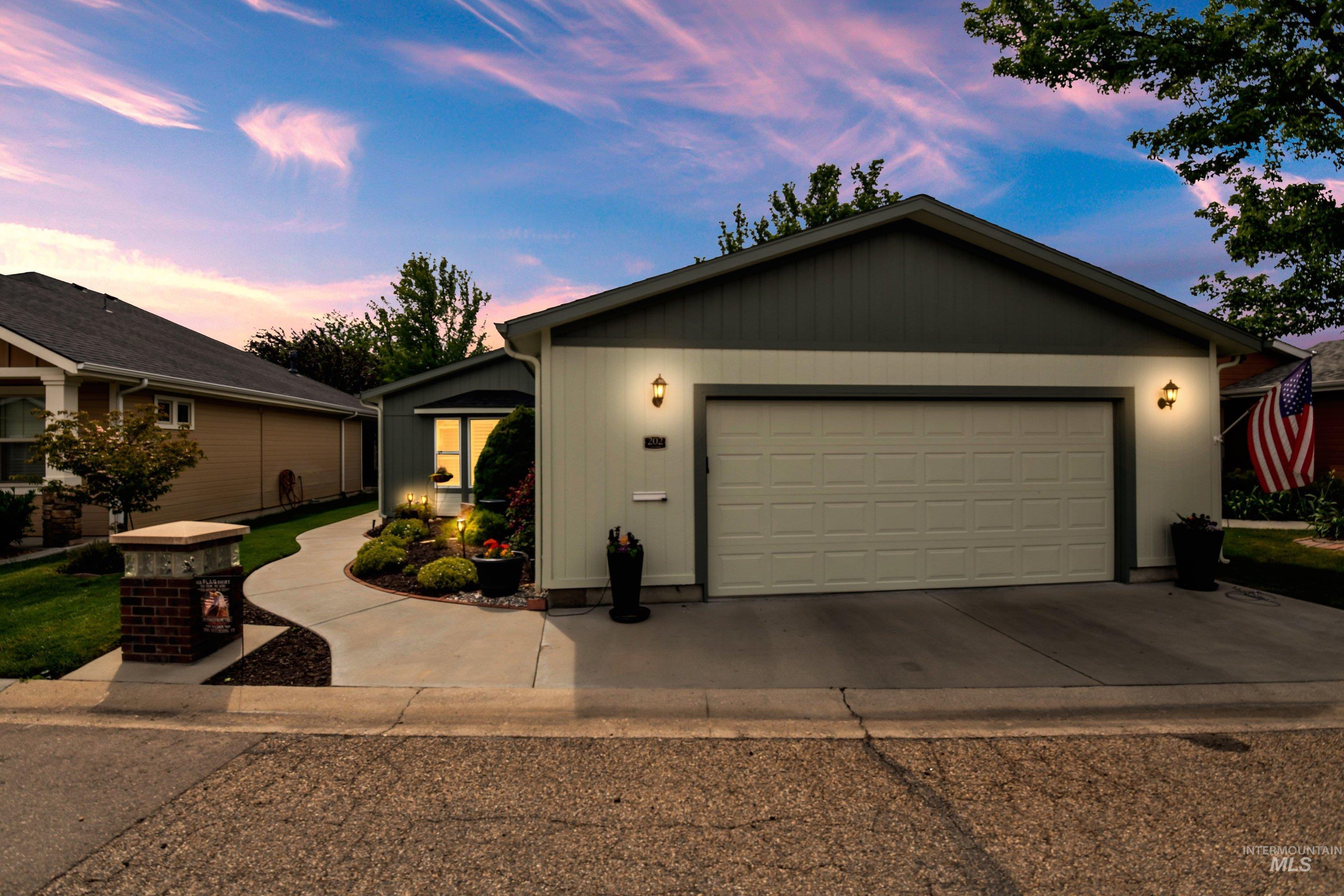 421 South Curtis Road, Unit 202 202 Boise, ID 83705 - Photo 2 of 41 Single-story residence featuring a two-car garage with a concrete driveway