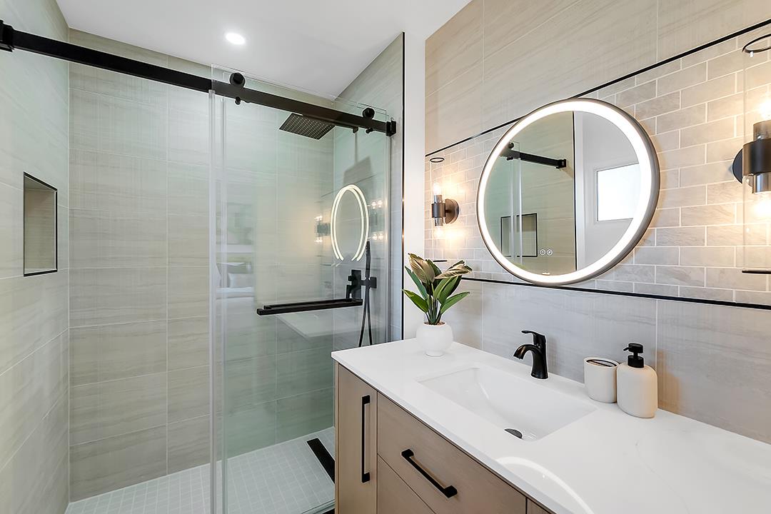 527 Maple Avenue Milpitas, CA 95035 - Photo 15 of 30 a bathroom with a sink mirror toilet and shower