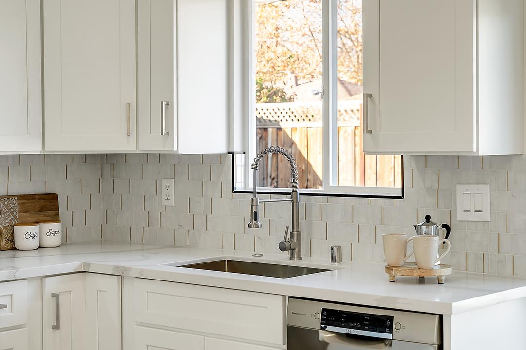 527 Maple Avenue Milpitas, CA 95035 - Photo 9 of 30 a kitchen with sink a window and cabinets