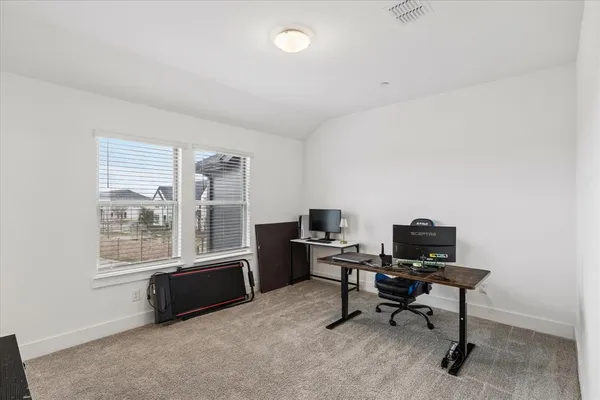 a room with furniture a flat screen tv and a fireplace