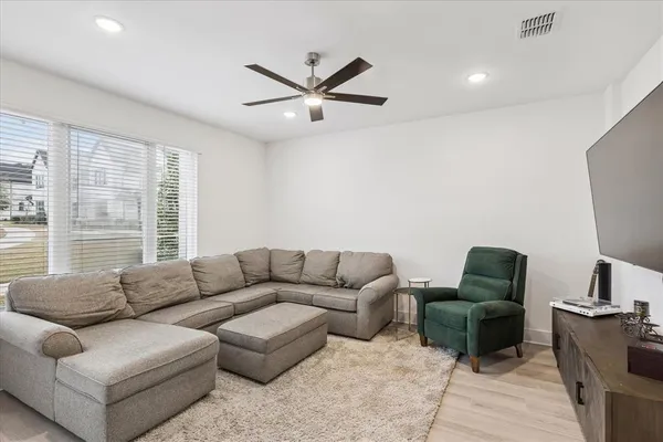 a living room with furniture and a window