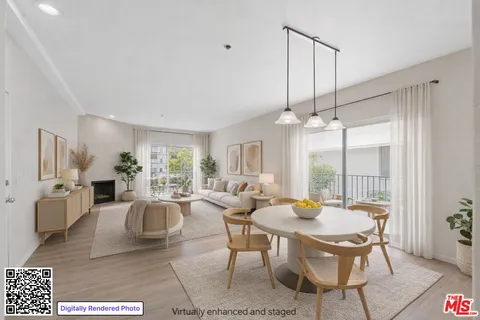 a living room with furniture a dining table and a chandelier