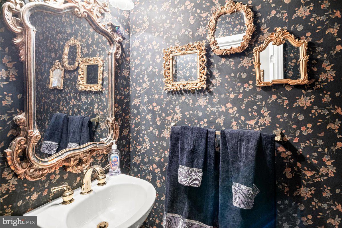 9 Spring Lake Court Barnegat, NJ 08005 - Photo 14 of 68 a bathroom with a sink and mirror with toilet