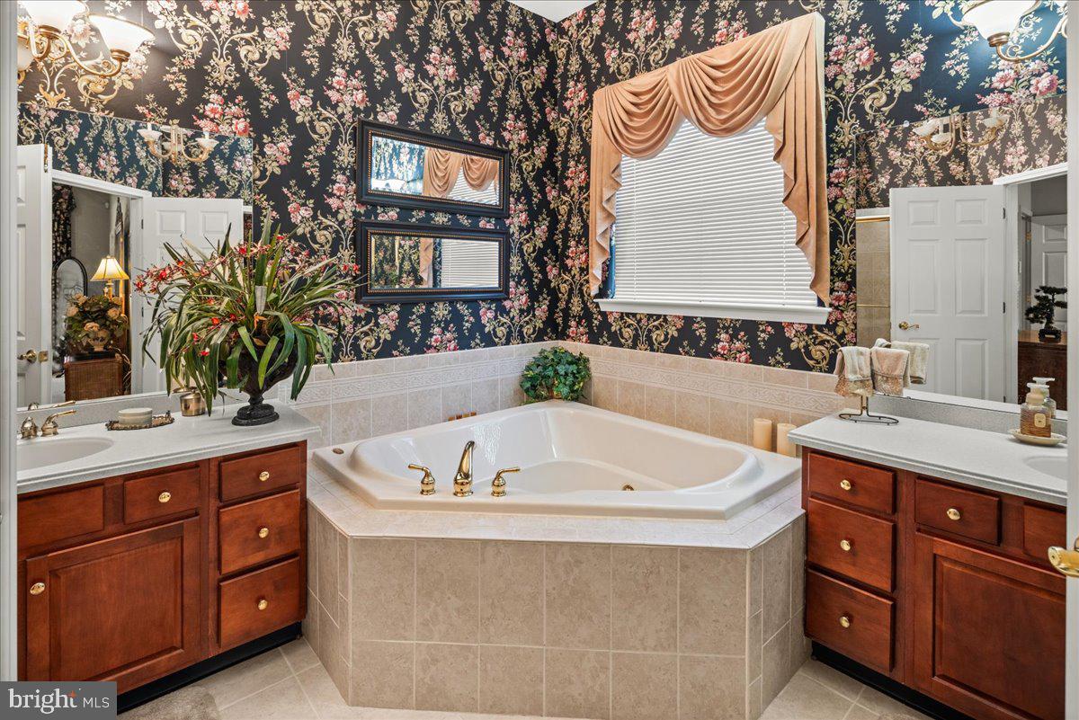 9 Spring Lake Court Barnegat, NJ 08005 - Photo 19 of 68 a bath room with a sink and a mirror