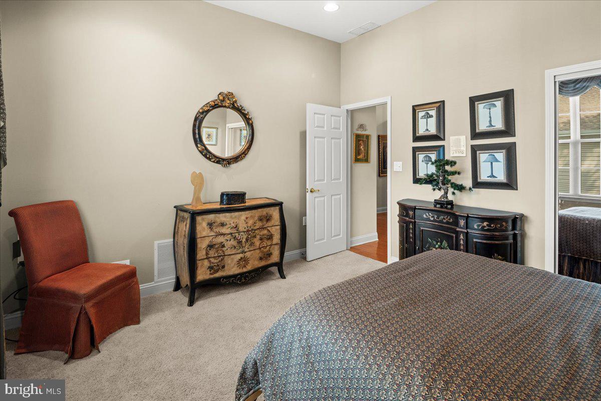 9 Spring Lake Court Barnegat, NJ 08005 - Photo 23 of 68 a bedroom with a bed a couch and dresser
