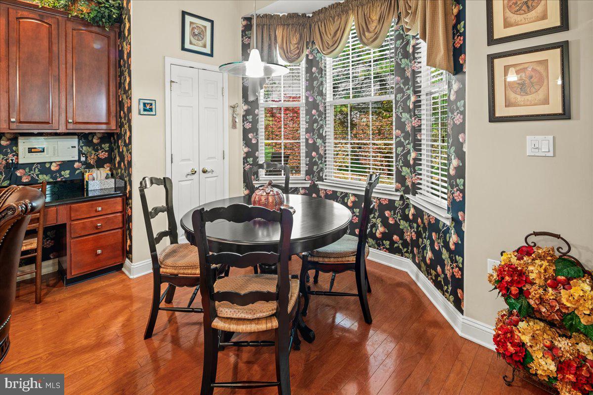 9 Spring Lake Court Barnegat, NJ 08005 - Photo 29 of 68 a dining room with furniture and wooden floor