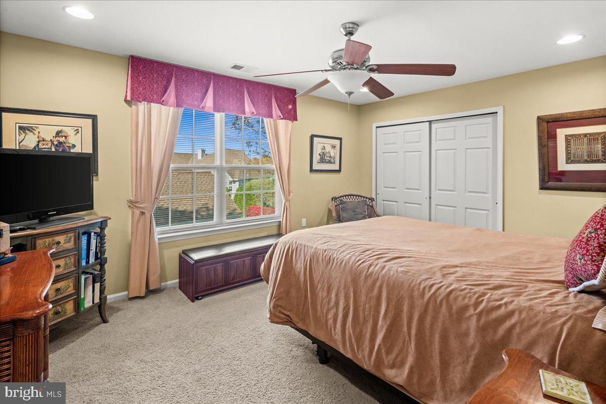 9 Spring Lake Court Barnegat, NJ 08005 - Photo 37 of 68 a bedroom with a bed and a flat screen tv
