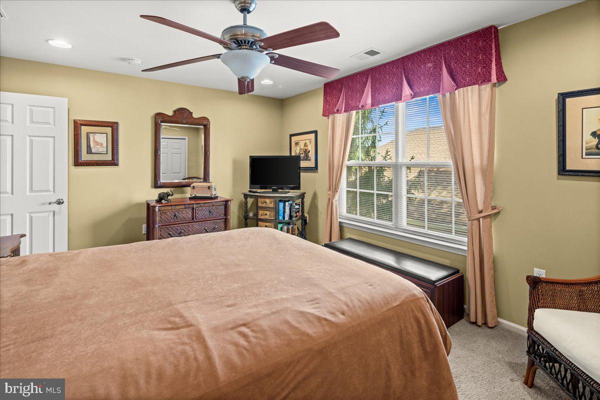 9 Spring Lake Court Barnegat, NJ 08005 - Photo 38 of 68 a bedroom with a bed and a flat screen tv