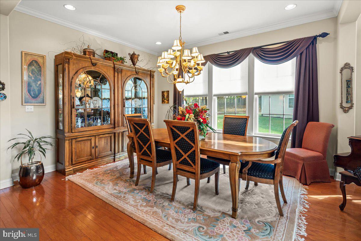 9 Spring Lake Court Barnegat, NJ 08005 - Photo 10 of 68 a view of a dining room with furniture window and wooden floor