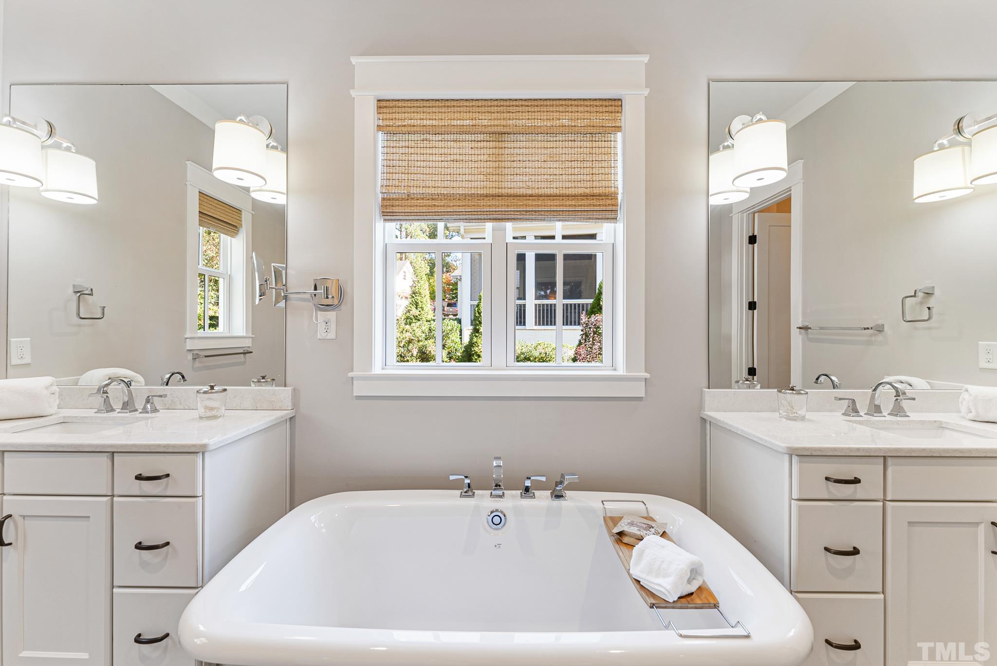 702 Cranbrook Road Raleigh, NC 27609 - Photo 23 of 57 a white bath tub sitting next to a white sink