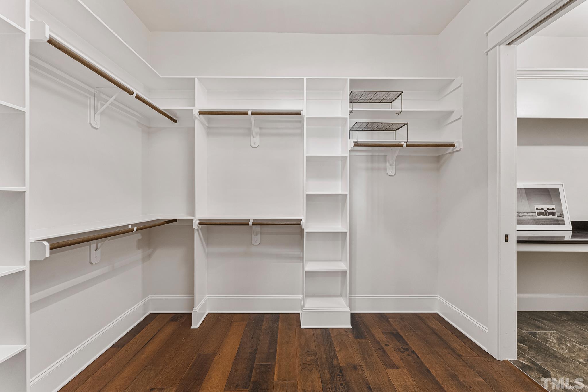 702 Cranbrook Road Raleigh, NC 27609 - Photo 25 of 57 a view of walk in closet with empty racks