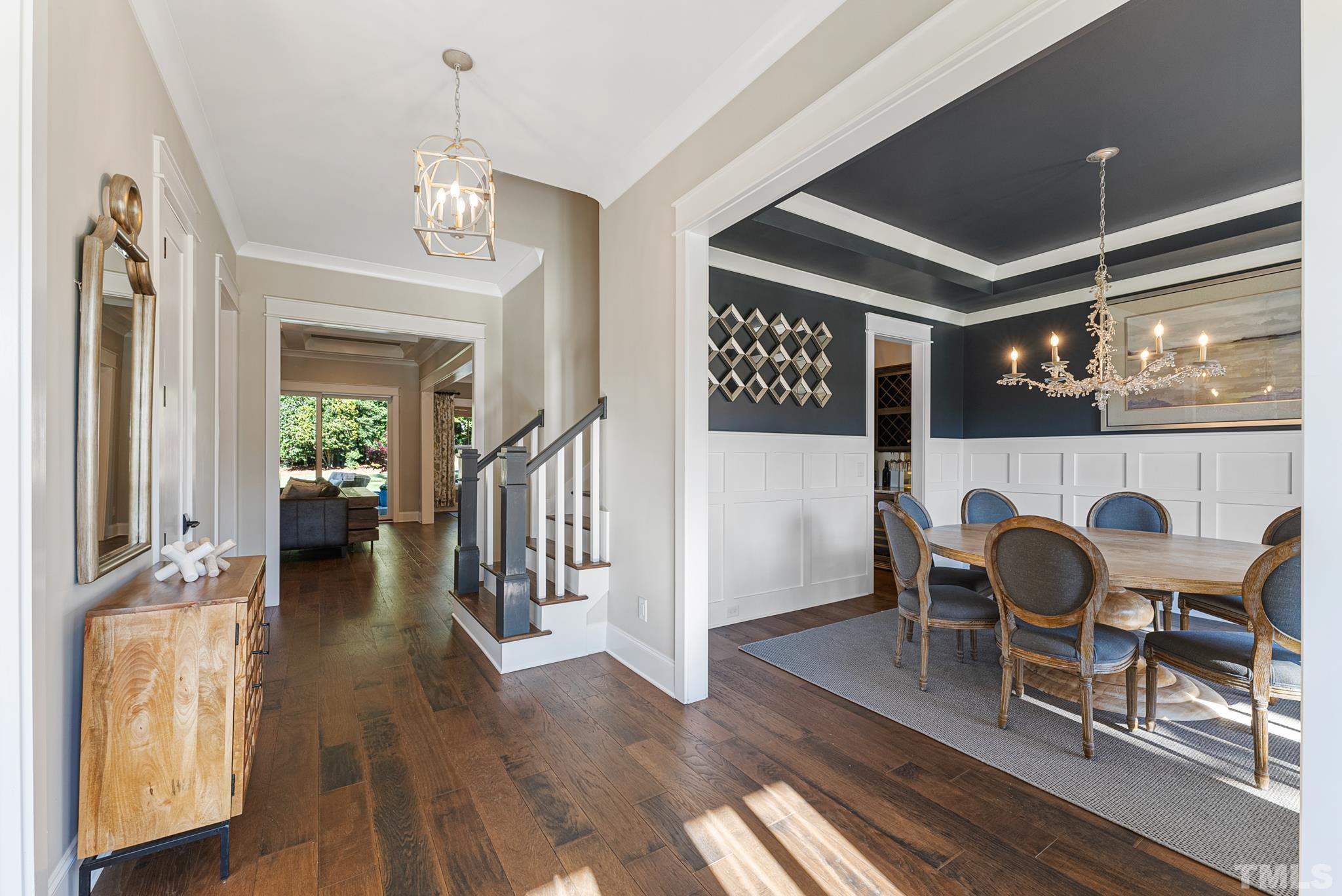 702 Cranbrook Road Raleigh, NC 27609 - Photo 5 of 57 a view of a dining room with furniture and wooden floor