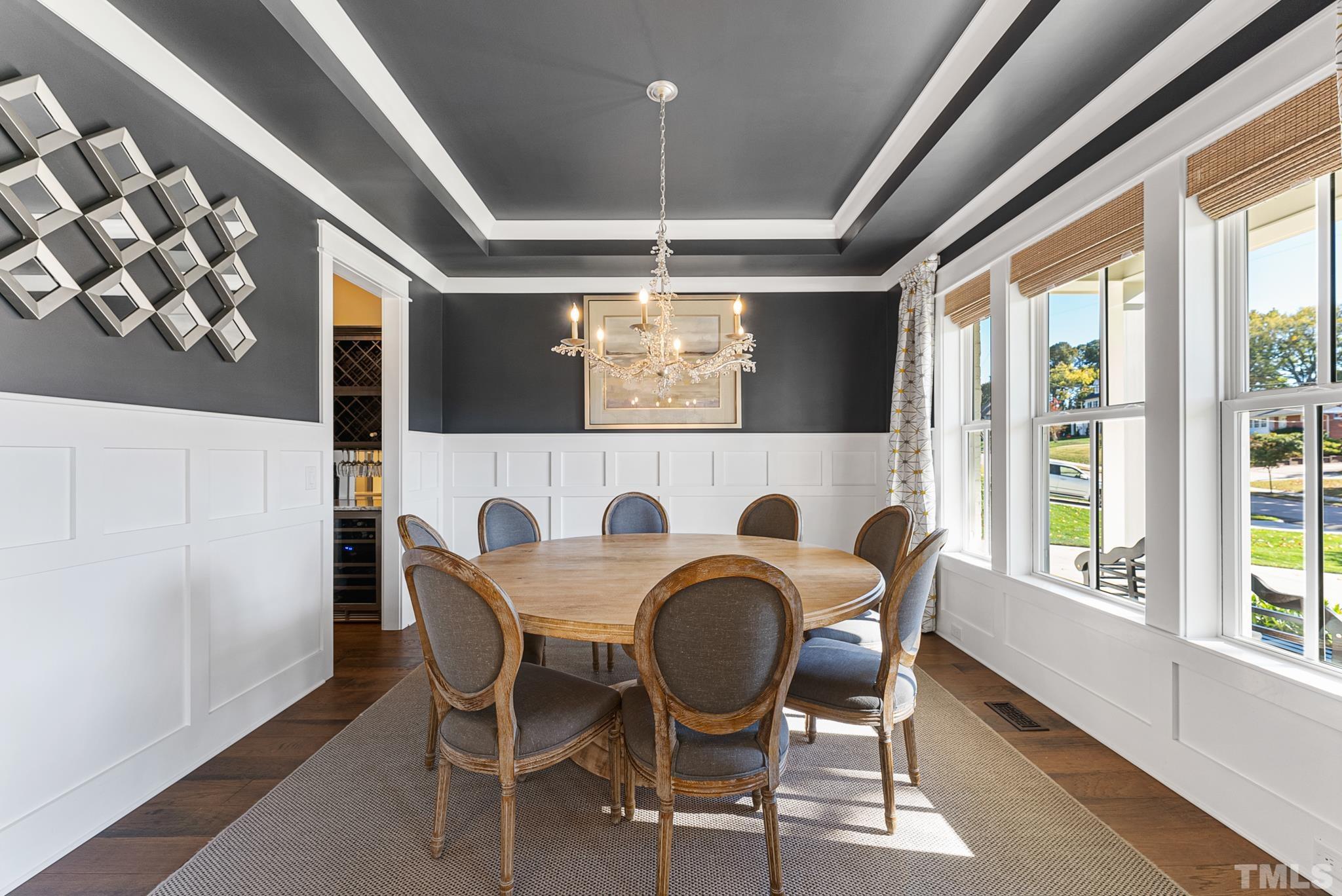 702 Cranbrook Road Raleigh, NC 27609 - Photo 7 of 57 a dining room with furniture and window