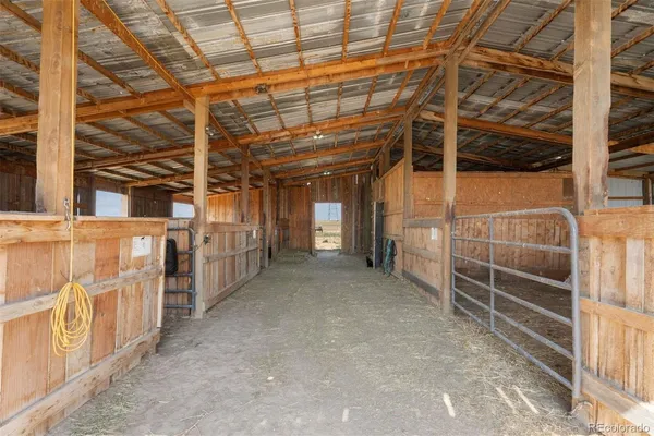 a view of an empty room with wooden walls