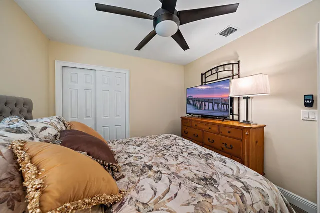 a bedroom with a bed and a dresser