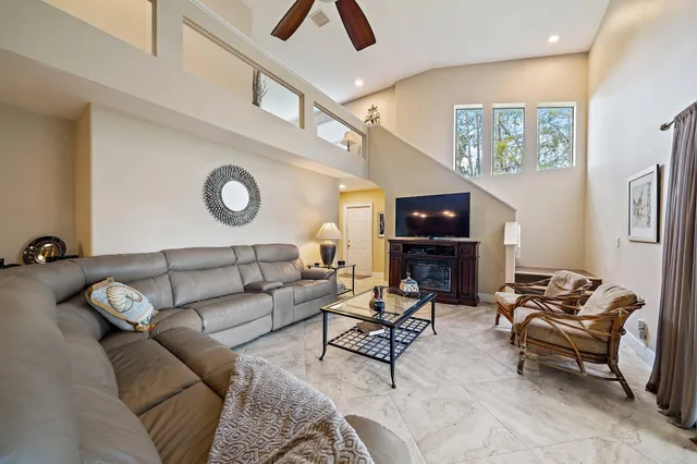 a living room with furniture and a clock