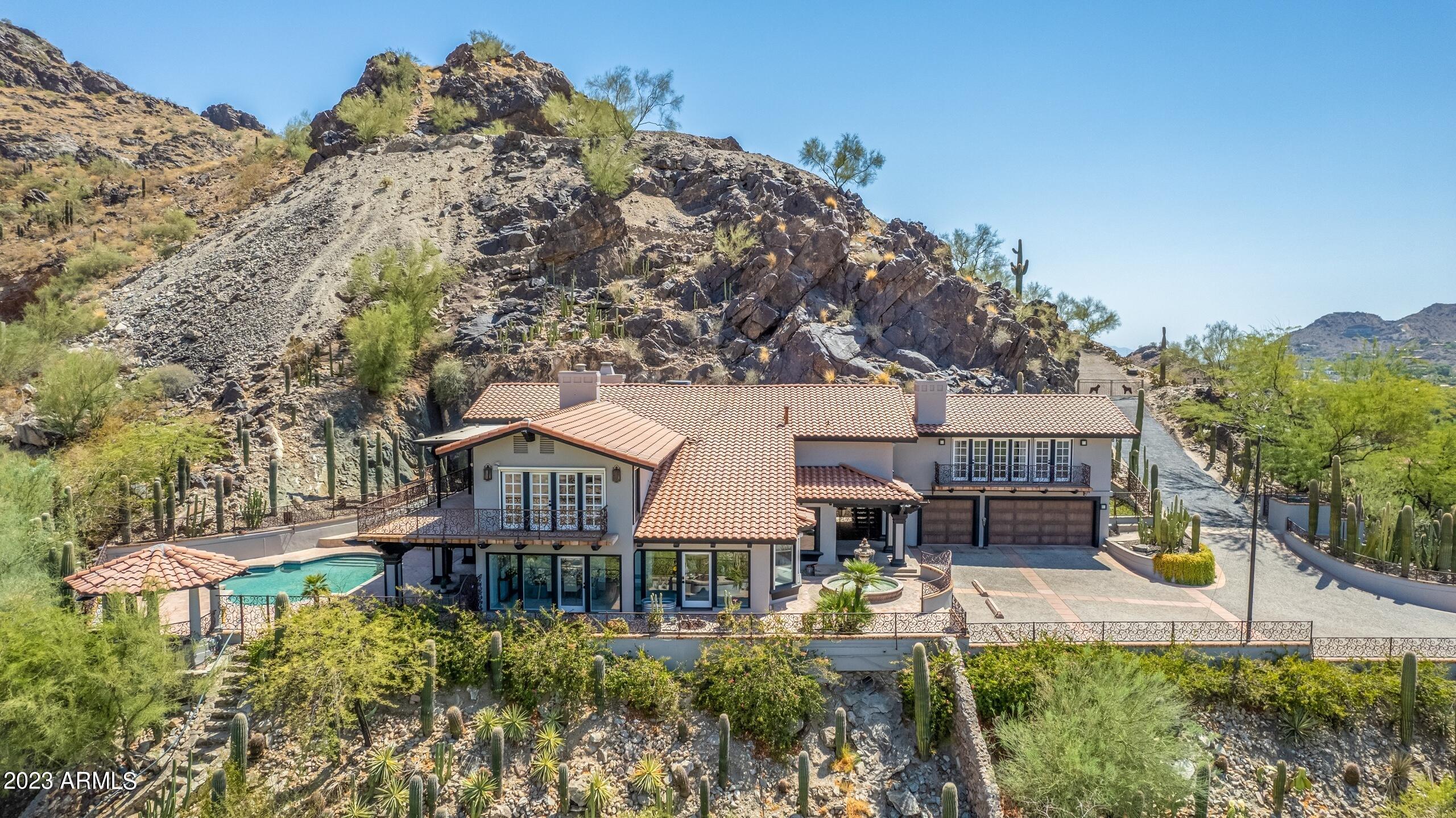 5339 East Desert Vista Road Paradise Valley, AZ 85253 - Photo 2 of 93 a aerial view of a house with swimming pool garden and patio