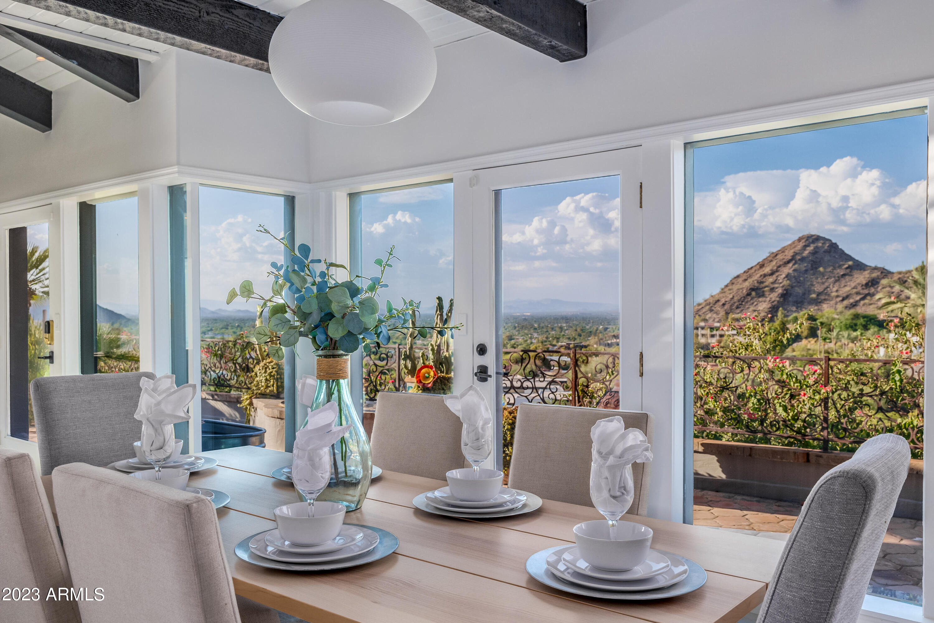 5339 East Desert Vista Road Paradise Valley, AZ 85253 - Photo 3 of 93 a view of a dining room with furniture window and wooden floor