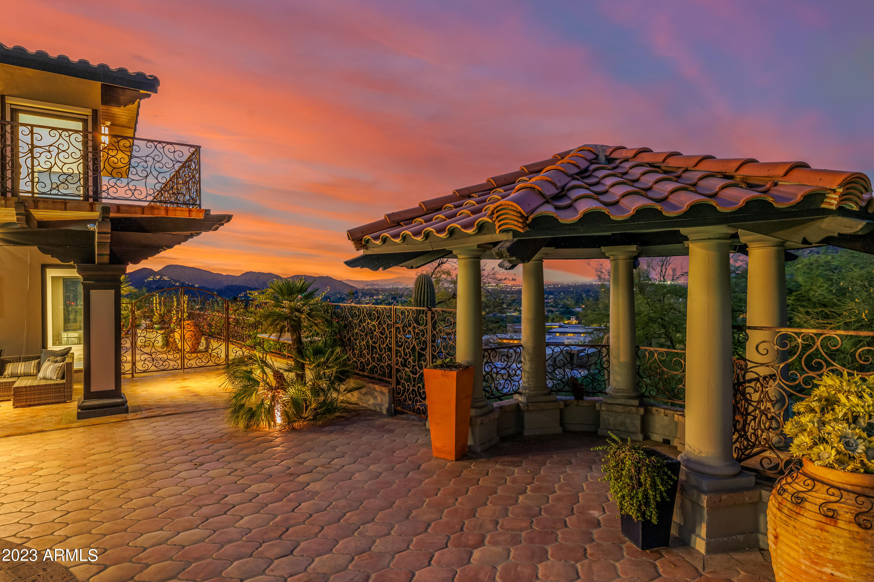 5339 East Desert Vista Road Paradise Valley, AZ 85253 - Photo 61 of 93 a view of a patio with a table and chairs under an umbrella