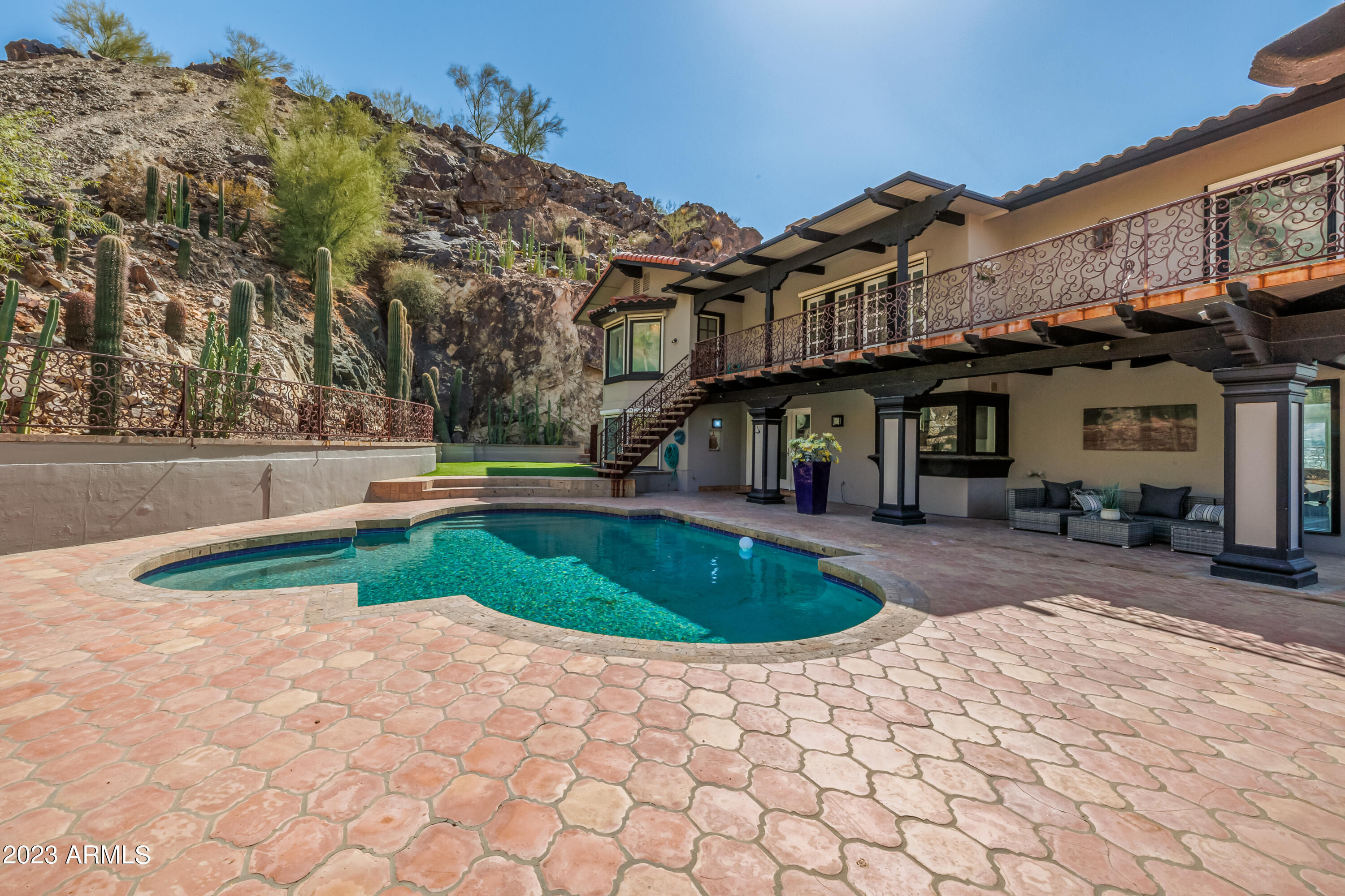 5339 East Desert Vista Road Paradise Valley, AZ 85253 - Photo 67 of 93 a front view of a house with a yard and trees