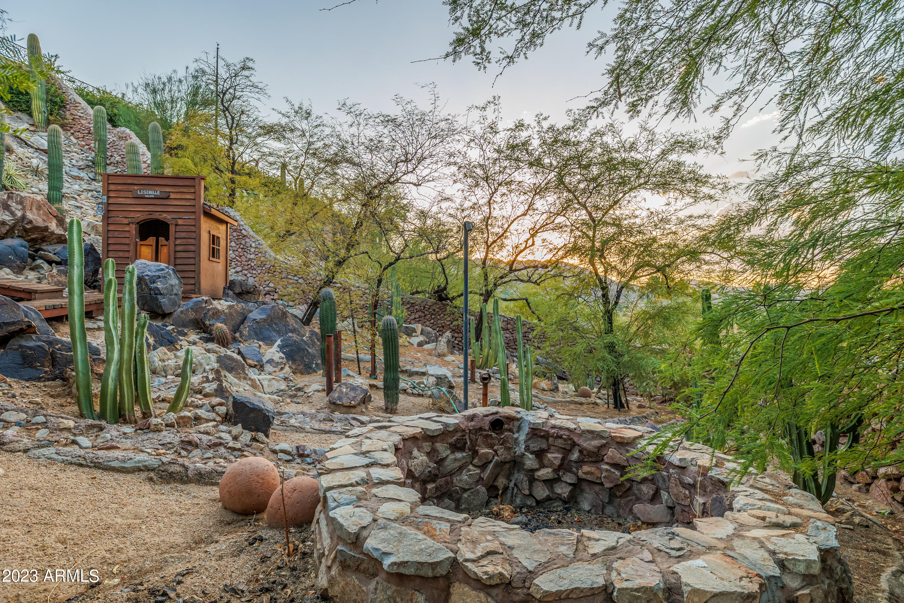 5339 East Desert Vista Road Paradise Valley, AZ 85253 - Photo 78 of 93 a view of a street with potted plants and large trees