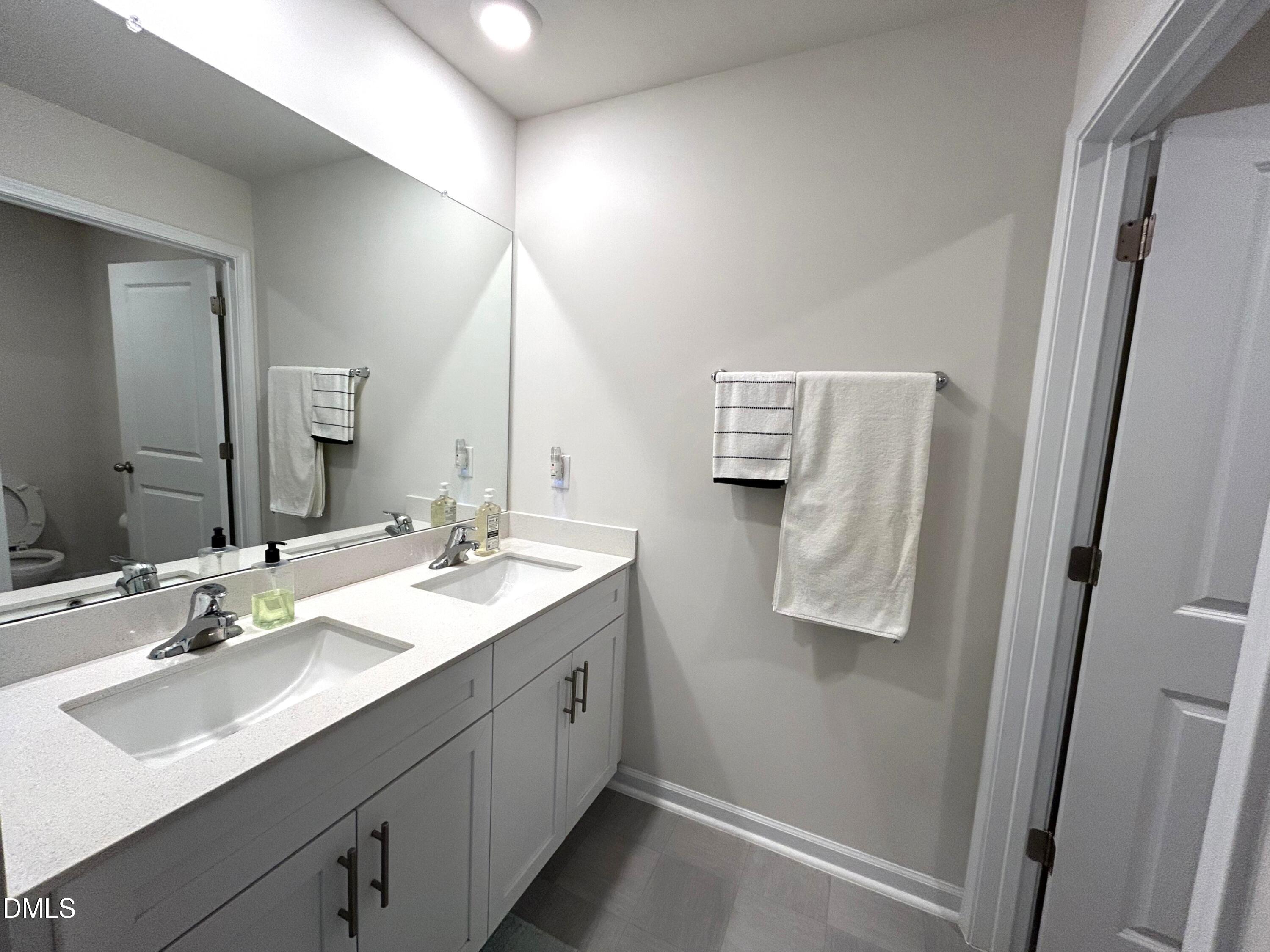 2264 Fletchers Ridge Drive Durham, NC 27703 - Photo 32 of 41 26. Dual vanity bath between bedroom 4 a