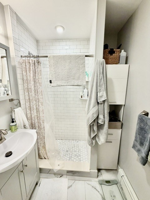 14 Cleveland Place, Unit 3 Boston, MA 02113 - Photo 20 of 22 a bathroom with a sink a mirror and shower