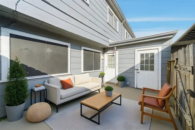 a outdoor living space with furniture and a potted plant