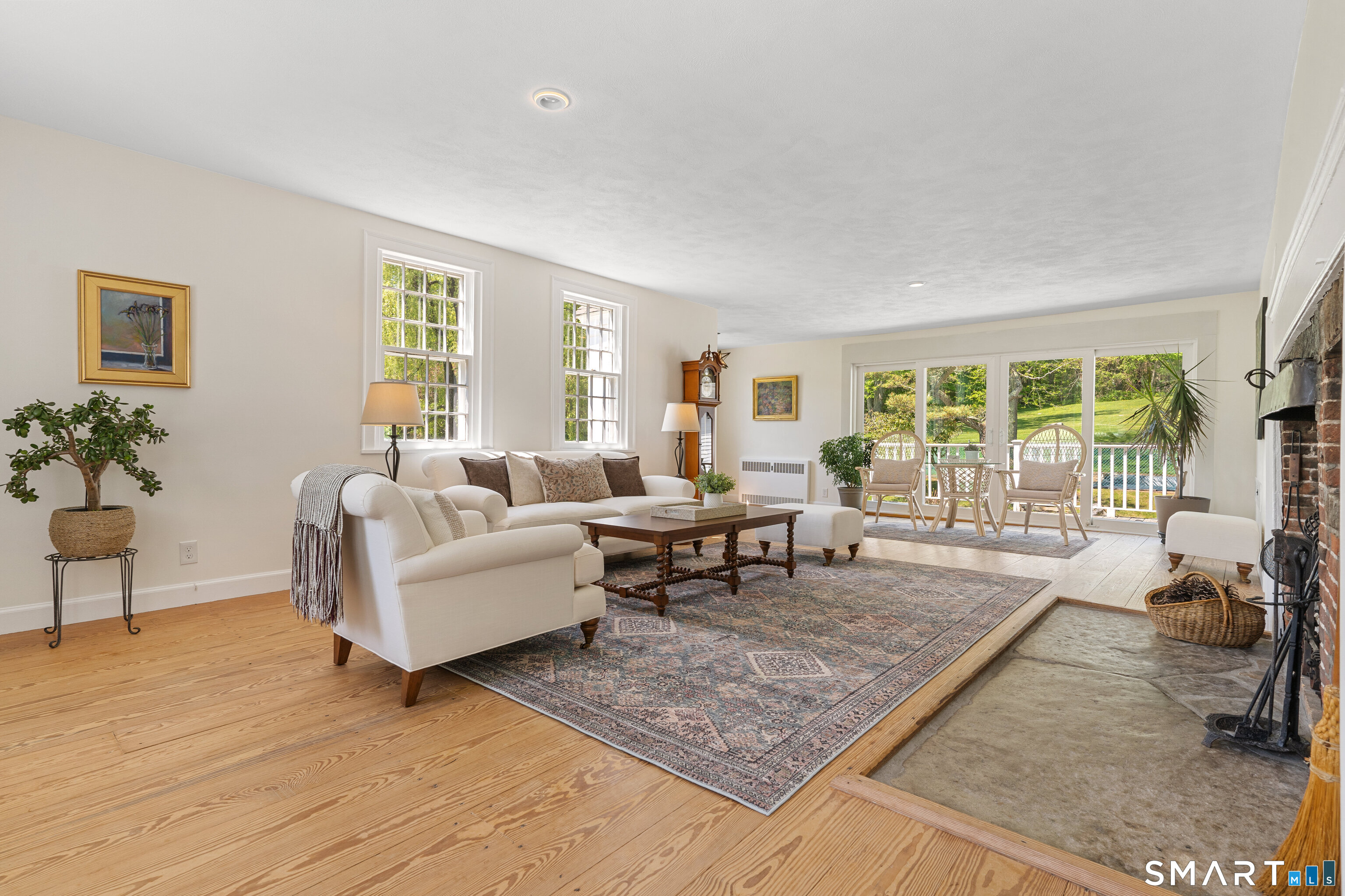 93 Upton Road Ashford, CT 06278 - Photo 6 of 40 Front-to-back family room offers casual versatility w/direct connection to deck & additional door entry.