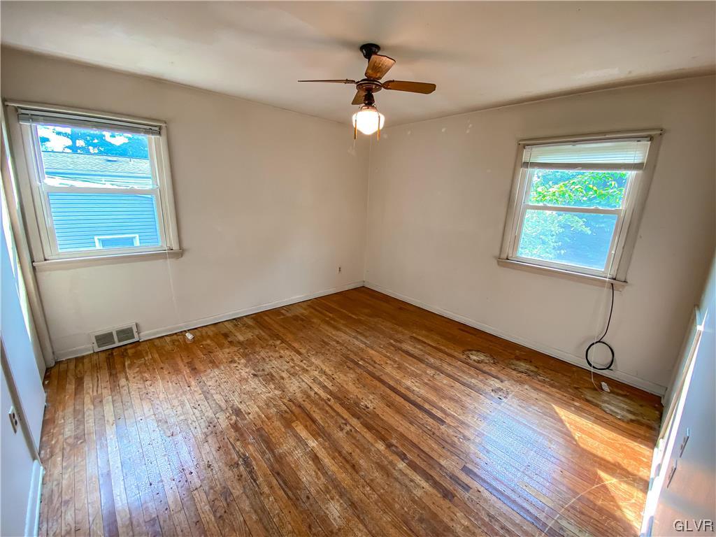 1934 Windsor Road Bethlehem, PA 18017 - Photo 19 of 32 a view of empty room with wooden floor and fan