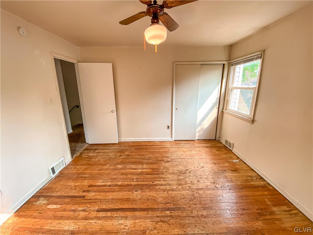 1934 Windsor Road Bethlehem, PA 18017 - Photo 20 of 32 wooden floor in an empty room with a window