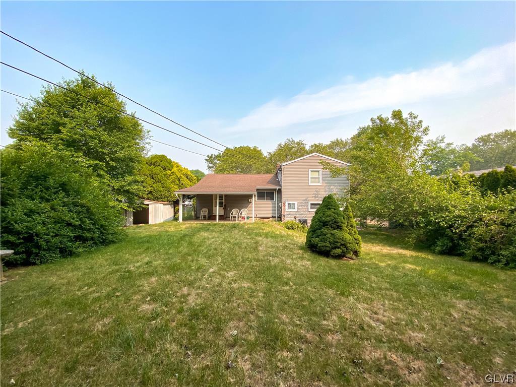 1934 Windsor Road Bethlehem, PA 18017 - Photo 27 of 32 a view of a house with a big yard potted plants and large tree